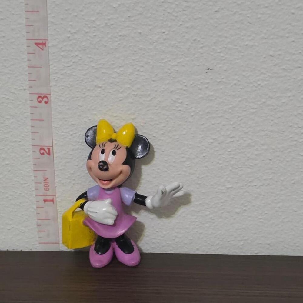 Disney Minnie Mouse figurine with yellow bow and purple dress #minniemouse #disn